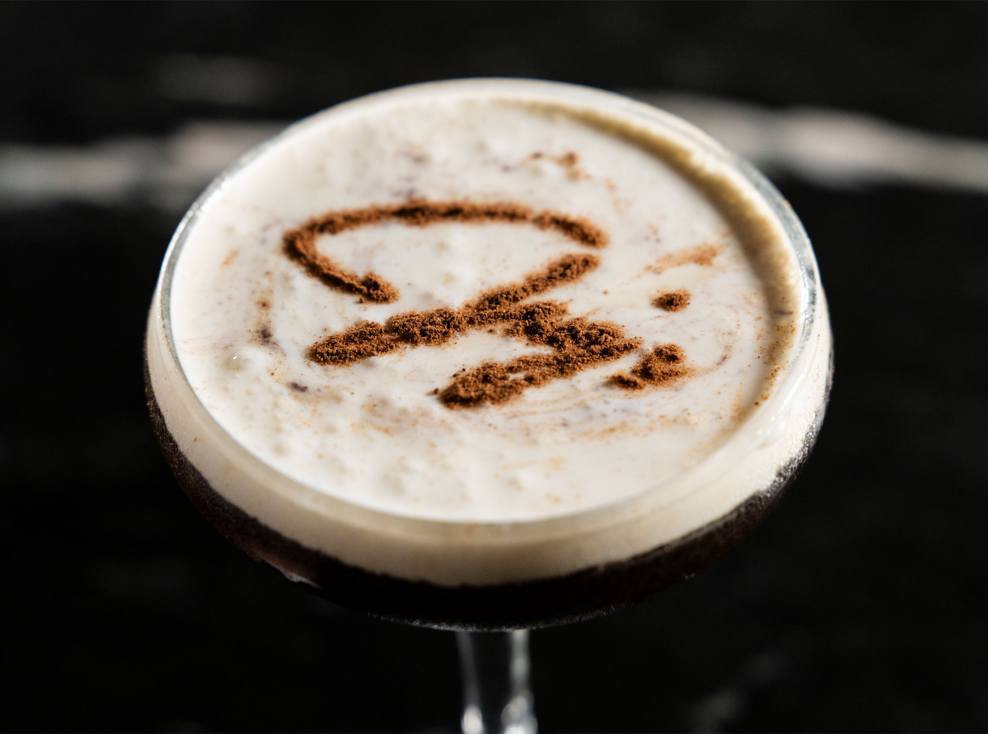 Jay's Cocktail with Jay's written in decoration on surface of drink.