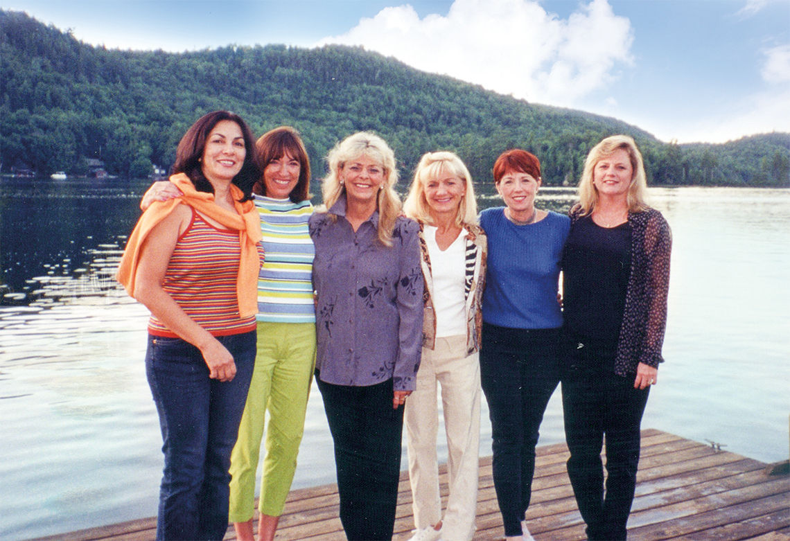 Chris Turner, Anne Woods, Judi Macy, Suzanne Schaffer, Lyn Pechuls & Donna Brigham meet in the Adirondack Mountains in July 2001. This trip was the beginning of the journey in authoring The Mothers' Club.