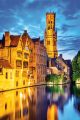 Dijver river canal & Belfort (Belfry) Tower. Photography: Shutterstock / Emi Cristea.