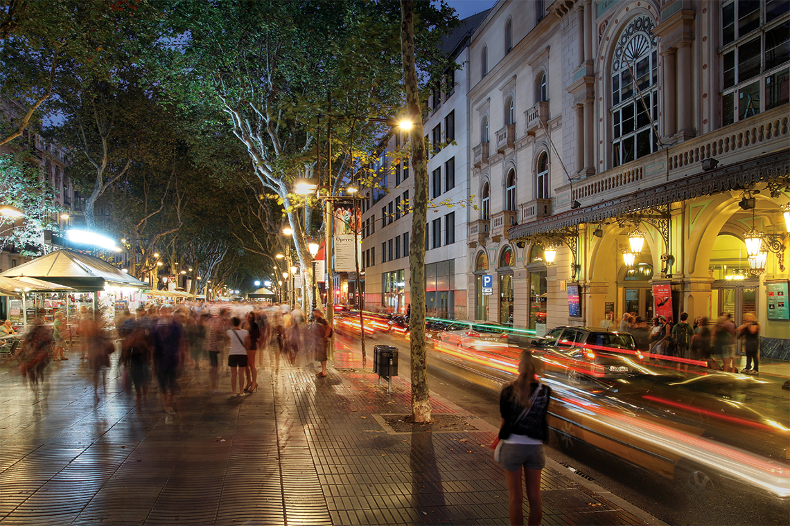 Crowded La Rambla street in the heart of Barcelona with the Gran Teatre del Liceu opera house on the right. Photography: Mihai-Bogdan Lazar.