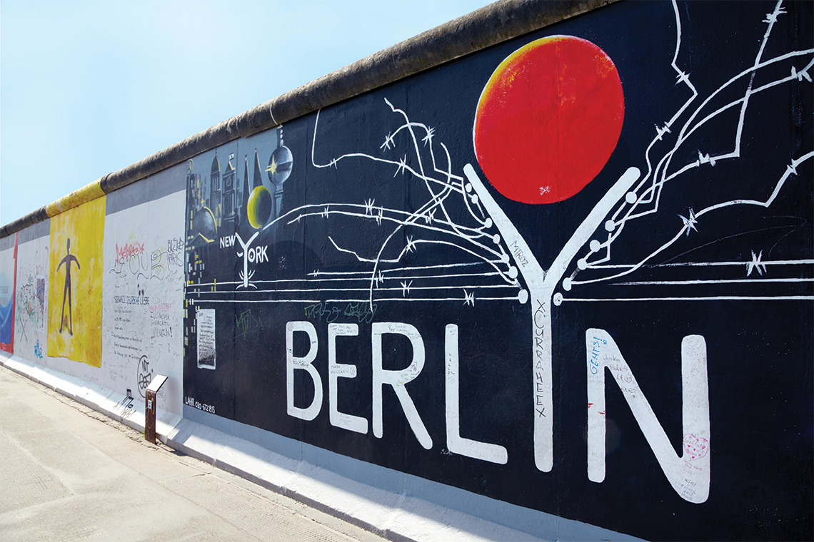 The East Side Gallery, a 1316-meter-long memorial section of the Berlin Wall. Photography: Shutterstock / AndersPhoto.