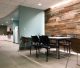 Random width reclaimed barnwood paneling used in an office break room.