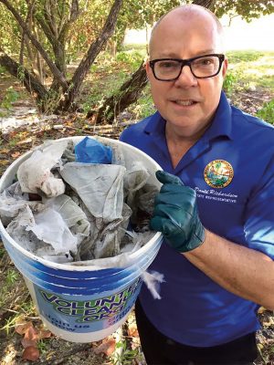 Rep. David Richardson participates in a waterway cleanup in Miami Beach. <em>Photography: Office of Rep. Richardson.</em>