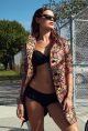 Floral jacquard coat by Etro, $868, available at Nordstrom, Aventura. Strapless bikini top by Gucci, available at Saks Off 5th, Sawgrass Mills. Ruffle bikini bottom by Gucci available at Saks Off 5th, Sawgrass Mills. Square signature sunglasses, by Chanel $340, available at chanel.com.