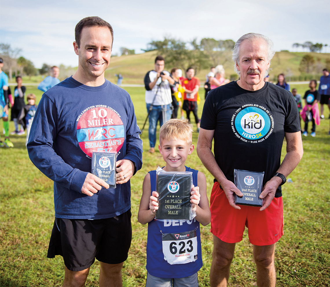 Top Overall Male Medal Recipients: First place Adrian Gandara, center, second place Michael Salyards, right, and third place Joel Gandara, left.