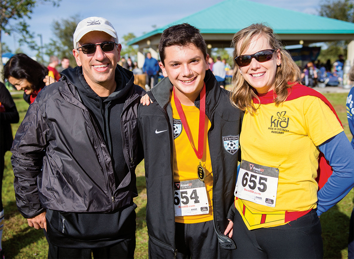 KID Auxiliary president Lynne Michaelides with husband Medon and son Gregory, who placed first in his age category.