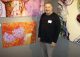 ArtServe artist-in-residence and participating artist Lee Berlin with his work.