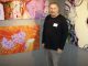 ArtServe artist-in-residence and participating artist Lee Berlin with his work.