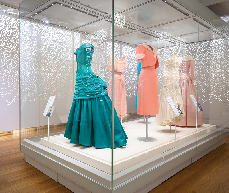 Exhibits from “Diana: Her Fashion Story,” including the dress she wore at the White House when she danced with John Travolta (right, center). Photography: Historic Royal Palaces.